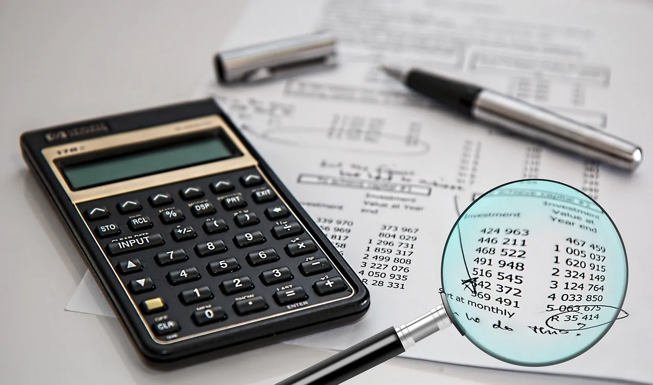 Audit, auditor, analysis, examination. Stock photo illustrating a guide to operating margin.